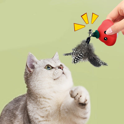 Red and white mushroom-shaped cat toy with cartoon eyes, a green loop, and a suction cup base, showing dimensions.