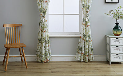 Dark gray semi-sheer curtains with a white and green floral pattern, hung on a black rod in a living room. - Image 19