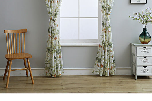 Dark gray semi-sheer curtains with a white and green floral pattern, hung on a black rod in a living room. - Image 19