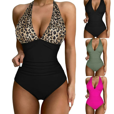 Black halter one-piece swimsuit with a deep V-neck and ruched detailing, designed for a slimming vacation look. - Image 14