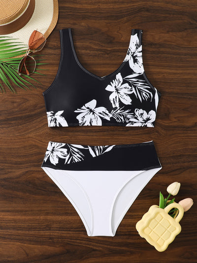 Women's two-piece swimsuit with black and purple floral print. Features a V-neck sports bra top and mid-rise bottom. - Image 26