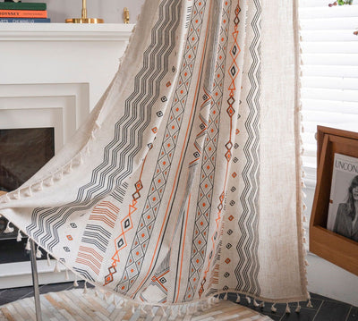 Boho cream cotton and linen curtain with tribal print in black and orange, featuring black fringe tassels. - Image 3