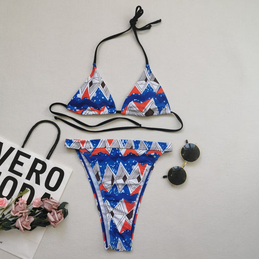 Red, white, and blue geometric print bikini with a triangle top and high-waisted, high-cut bottom. - Image 10