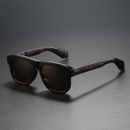 Black square-frame polarized sunglasses with dark lenses, suitable for both men and women, on a dark gray surface. - Image 13
