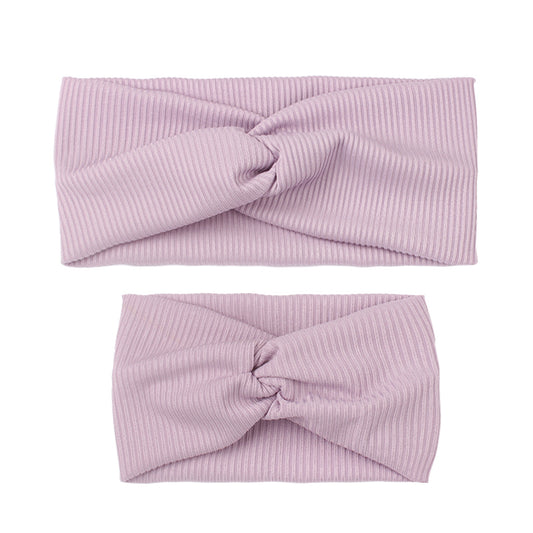 Matching dusty rose ribbed knit headbands with a twisted knot, one for an adult and one for a child. - Image 2
