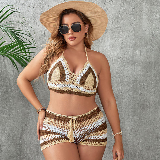 Woman in a blue and white striped crochet two-piece swimsuit with a halter top and high-waisted shorts. - Image 4
