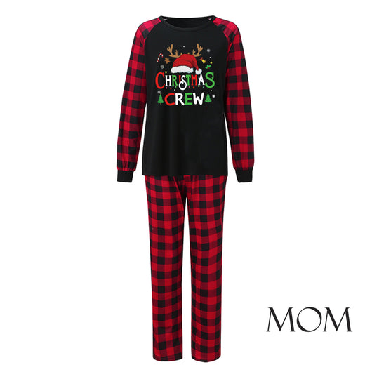 Man wearing a Christmas pajama set with a black long-sleeve top and red and black buffalo plaid pants. - Image 11