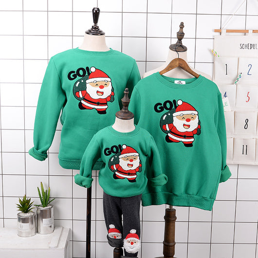 Red parent-child Christmas sweaters with a cartoon Santa Claus graphic, displayed on adult and child mannequins. - Image 9