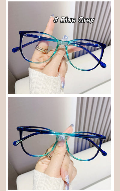 Black full-frame round anti-blue light glasses held by a hand with a gold ring and light blue gradient nails. - Image 27