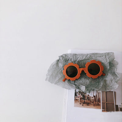 Orange flower-shaped sunglasses for babies and toddlers with dark lenses and a plastic frame. - Image 12