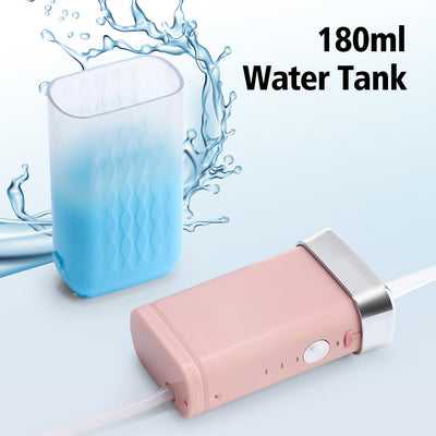 Portable water flosser in gradient pink and blue with four nozzles, a charging cable, and its product box. - Image 35