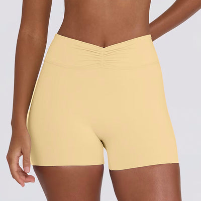 Light pink halter neck sports bra and high-waisted leggings workout set on a model. - Image 22