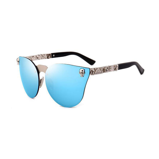 Pink mirrored cat-eye sunglasses with gold-toned frames, skull, and floral embellishments on the temples. - Image 10