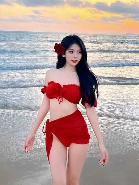 Woman in a red strapless ruffled bikini top and matching sarong on a beach at sunset. - Image 6