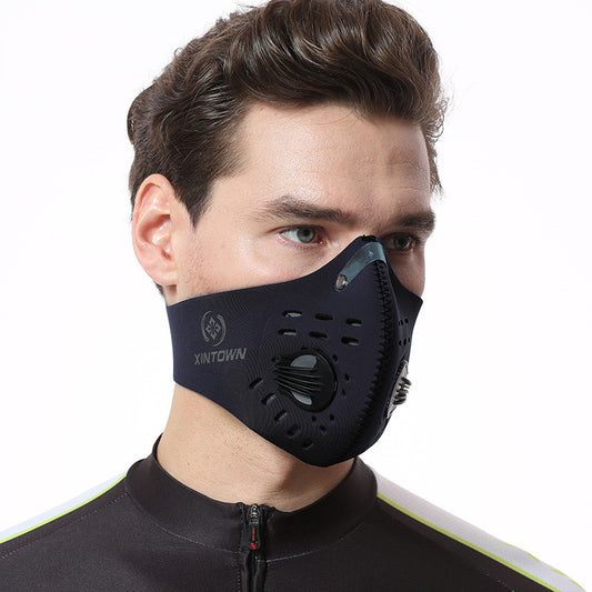 Black nylon bicycle mask with activated carbon filter, exhalation valve, and metal nose clip.