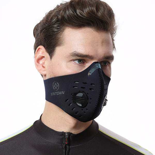 Black nylon bicycle mask with activated carbon filter, exhalation valve, and metal nose clip.