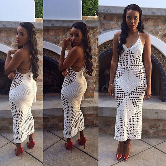 Woman wearing a white hollow-knit one-piece swimsuit with spaghetti straps and a geometric crochet pattern. - Image 2
