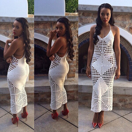 Woman wearing a white hollow-knit one-piece swimsuit with spaghetti straps and a geometric crochet pattern. - Image 2