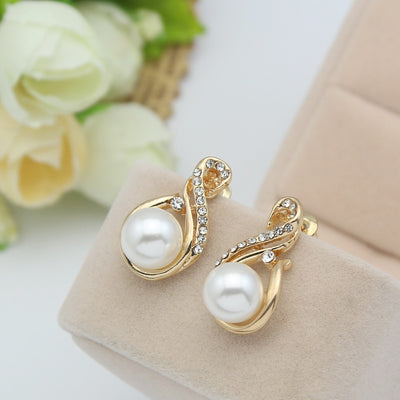 Gold-tone necklace and matching earrings set with white faux pearls and clear rhinestones, ideal for bridal or dinner wear. - Image 8