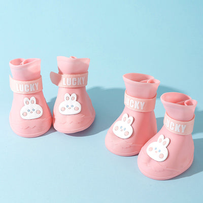 Four yellow silicone dog booties with a cartoon dog face emblem and "LUCKY" strap on a light blue background. - Image 7