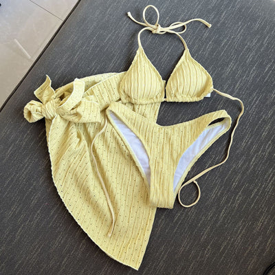 White textured bikini with ruched triangle top, high-cut bottom, and matching sarong with a large bow. - Image 7
