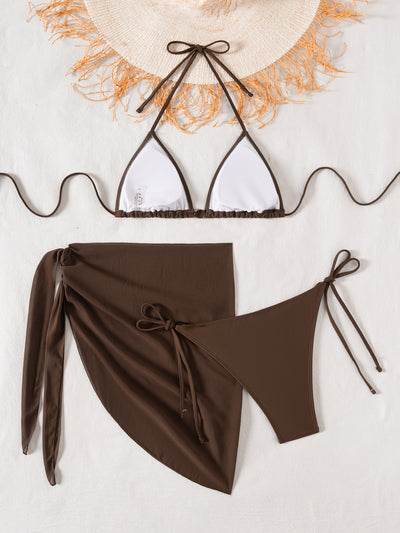 Solid brown three-piece bikini swimsuit set with a triangle top, beaded accessory, and matching sarong skirt. - Image 13