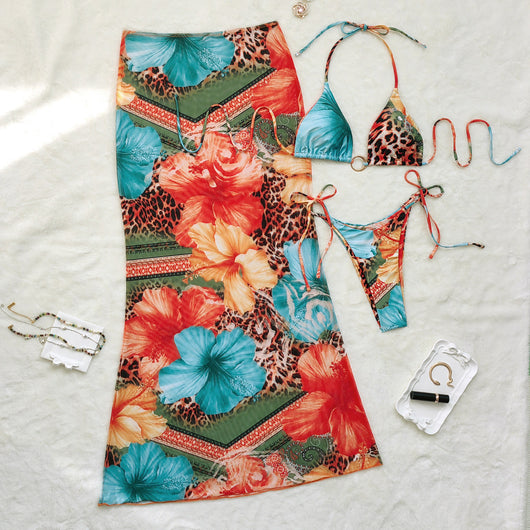Leopard print and hibiscus floral bikini set with sheer maxi cover-up dress in red, orange, blue, and green. - Image 3
