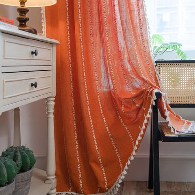 Black polyester curtain with white jacquard multi-line pattern and black tassels, draped over a white chair. - Image 29