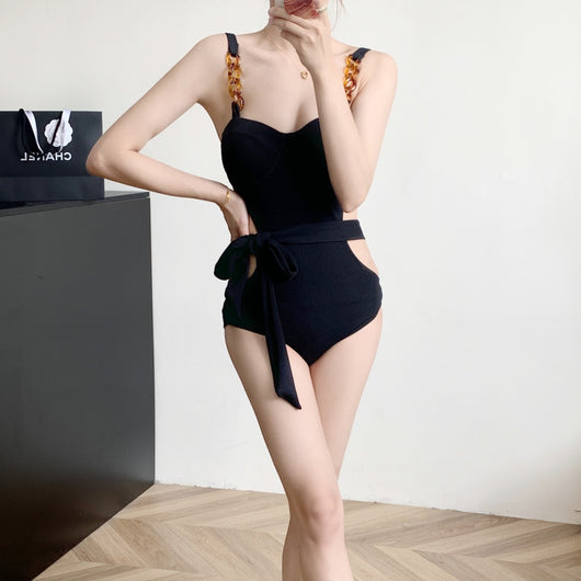Black ribbed one-piece swimsuit with sweetheart neckline, chain-link shoulder strap, side cut-outs, and self-tie waist. - Image 14
