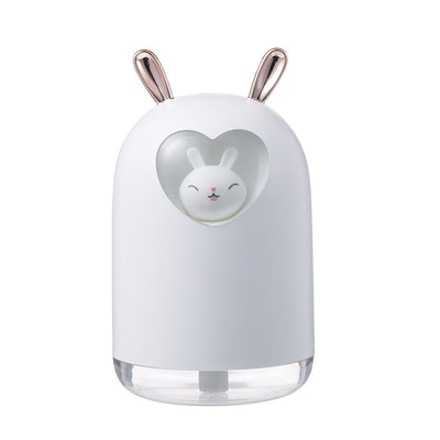 White rabbit humidifier with rose gold ears, a heart-shaped cutout, and a smiling bunny figure inside. - Image 9