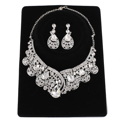 Silver-tone necklace and matching drop earrings set with clear rhinestones and teardrop crystals, ideal for weddings. - Image 8