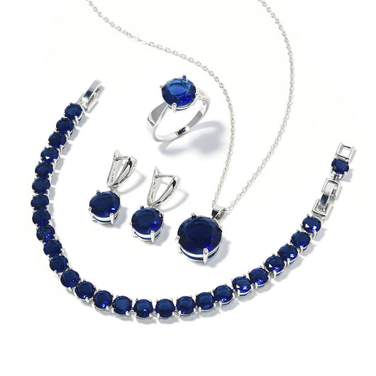 Four-piece jewelry set with silver-toned metal and round deep pink gemstones, including a necklace, bracelet, ring, and earrings. - Image 21
