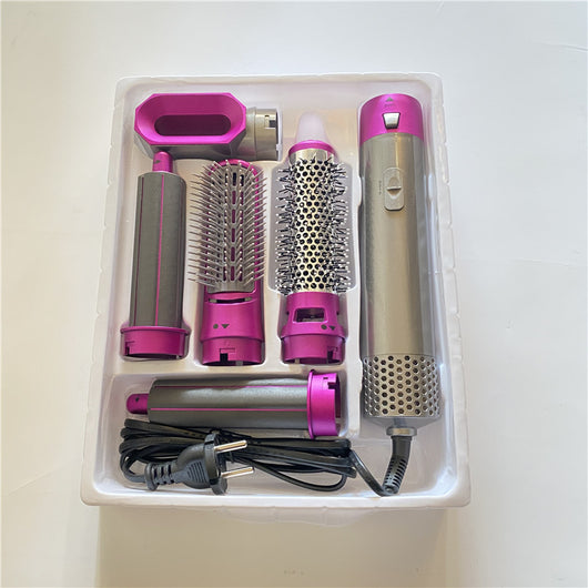 5-in-1 hot air comb hair dryer set with multiple rose red and gray attachments in a white tray. - Image 13