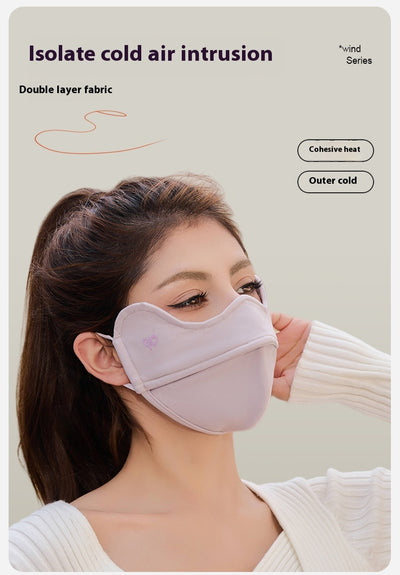 Woman wearing a grey outdoor cycling wind mask with ear hooks and a small heart logo, designed for cold-proof eye protection. - Image 10