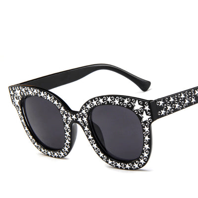 Black cat-eye sunglasses for ladies, featuring silver star embellishments on the frames and temples. - Image 4