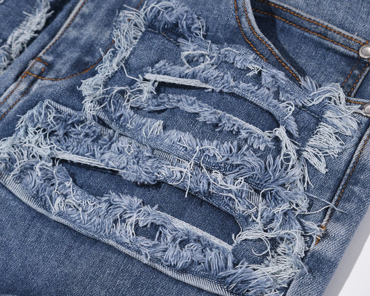 Jeans Azul Rotos con Parches y Detalles Desgarrados - Image 3