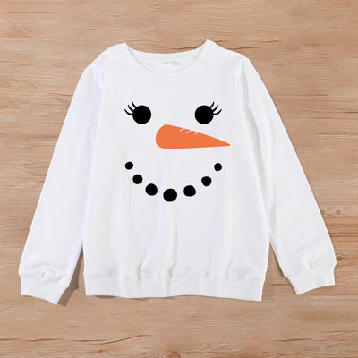 Family matching white long-sleeve crew neck tops with a cute snowman face print, featuring black eyes, an orange carrot nose, and a dotted smile. One adult top - Image 28