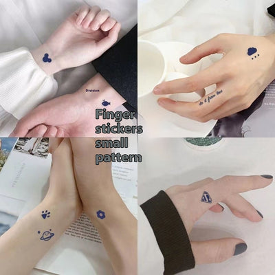 Sheet of 24 black outline doodle temporary tattoo stickers including a bow, heart, crown, sun, stars, and flowers.