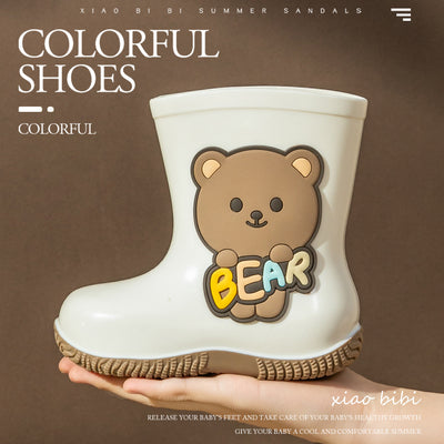 White children's rain boots with a brown cartoon bear holding colorful 'BEAR' lettering and a white fleece lining.