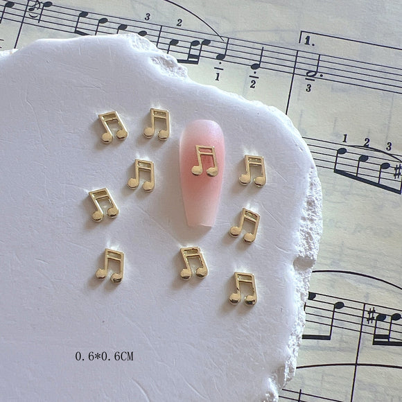 Accesorios de Uñas Metálicos con Símbolos Musicales