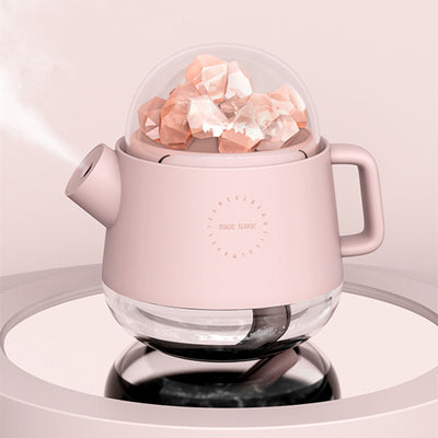 Pink kettle-shaped mini USB humidifier with a clear dome top filled with pink salt crystals, emitting mist. - Image 7