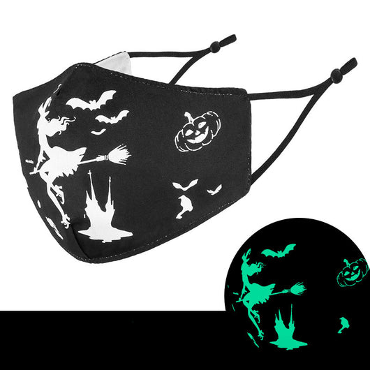 Black cloth face mask with white Halloween witch, bats, and jack-o'-lantern pattern, shown glowing green in the dark. - Image 12