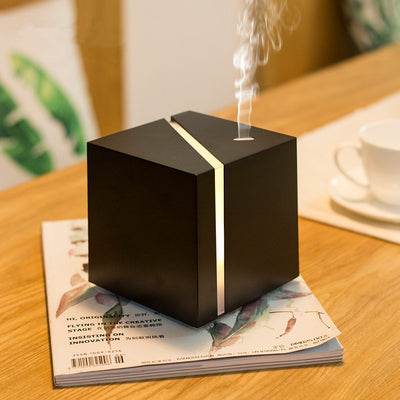 White and grey marble pattern ultrasonic aromatherapy diffuser with a vertical gold LED light strip and power button. - Image 8