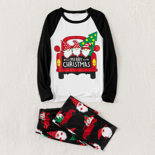 White and black raglan long-sleeve Christmas pajama top with red truck and gnome graphic, black gnome print pajama pants.