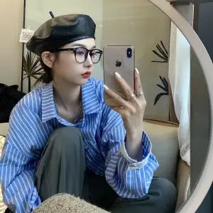 Retro square transparent full-frame glasses with blue light lenses, held by a person wearing grey sweatpants. - Image 16