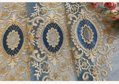Blue sheer curtain with intricate gold and dark blue embroidery in a European classical style, draped over a window. - Image 26