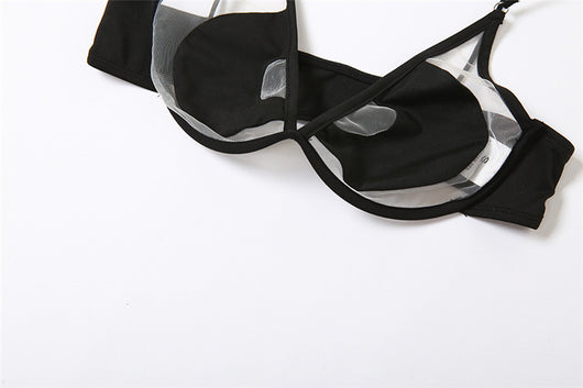 Woman wearing a white two-piece bikini with a bralette top featuring sheer cut-outs and a high-cut thong bottom with multiple straps. - Image 14