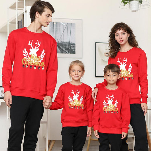 Family matching white long-sleeve crew neck tops with a cute snowman face print, featuring black eyes, an orange carrot nose, and a dotted smile. One adult top