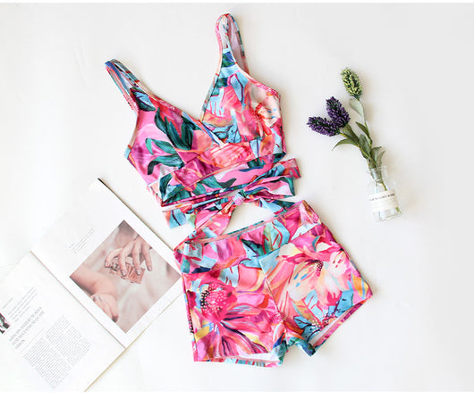 Women's three-piece swimwear set with a cream floral print, ruffled crop top, high-waisted shorts, and matching sarong. - Image 2