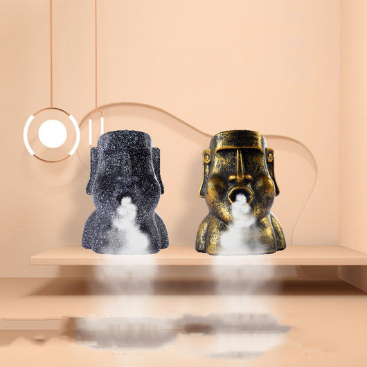 Retro gold and black stone portrait humidifier ornament emitting mist, mounted on a textured wall. - Image 4